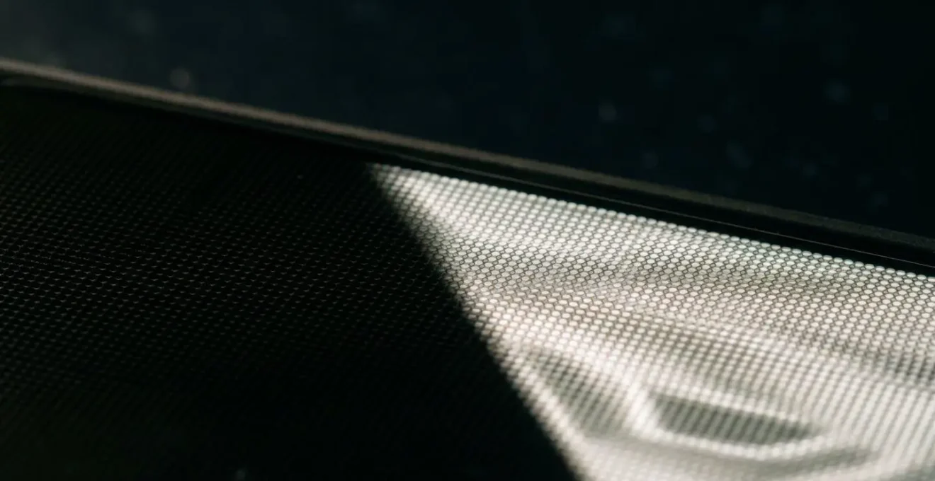 Close-up view of illuminated AMOLED display showing perfect black pixels and vibrant content during late-night reading session