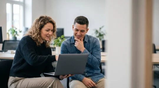 Developers collaborating on code review workflow with pull request approval process